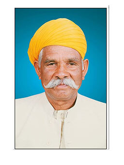 Photo of old man with yellow turban 